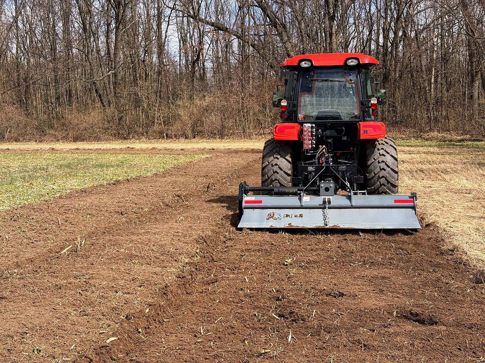 7 ft Dirt Dog Tiller Above Freshly Tilled Soil