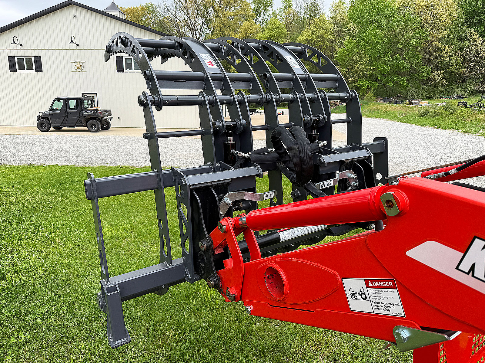 Rear View of Big Mouth 327 Grapple on Kioti DK6010 Tractor