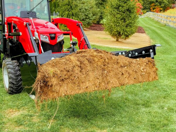 Moving soil with the GWT VersaPusher in the bucket position